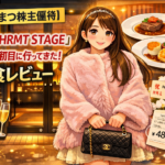 ひらまつ株主優待を利用して新店「HRMT STAGE」のオープン初日に訪問した様子を描いたイラストのアイキャッチ。ピンクのファーコートを着たなぎちゃんが店舗前に立ち、コース料理とワイン、会計金額48,200円のイメージが描かれている。
